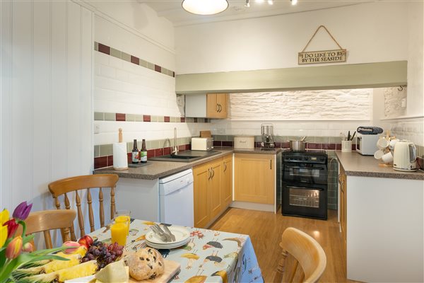 Kitchen and dining area in The Farmhouse which is dog friendly